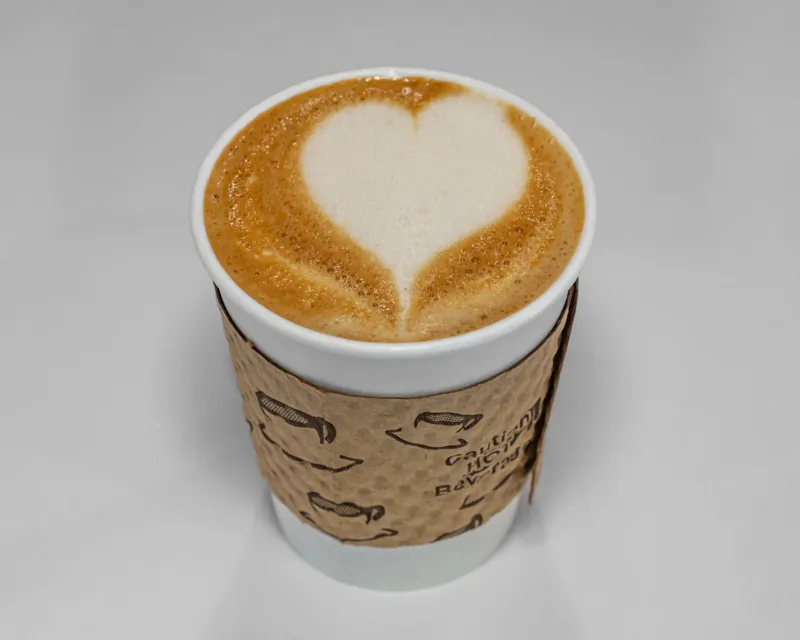 Latte with art in a glass cup